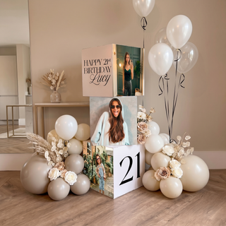 Personalised Photo Birthday Display | Stacked photo cubes with neutral balloons, white flowers and floating balloons