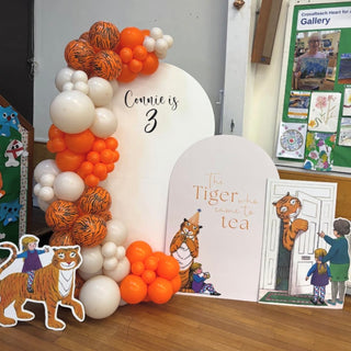 Tiger Who Came to Tea Birthday Backdrop | Orange balloon display with tiger cut-outs and storybook panels