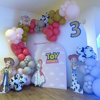 Toy Story Birthday Backdrop | Pink and blue balloon display with Woody, Jessie, Bo Peep and character cut-outs